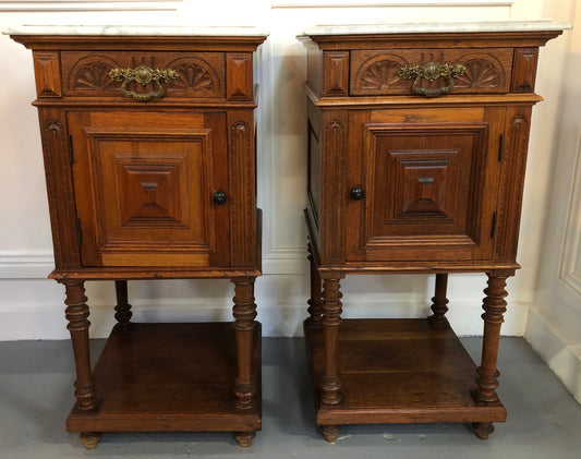 Pair of French Oak Arts and Crafts bedsides cabinets with lovely Carrara marble top and drawer and cupboard for storage. In good original detailed condition.