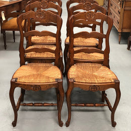 Set of six French rush seat dining chairs and in good sturdy condition.