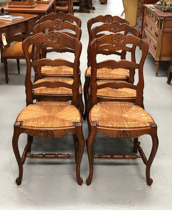 Set of six French rush seat dining chairs and in good sturdy condition.