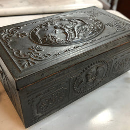 Vintage Cedar & metal box with decorative scene of cupid and a lady. Is in good original condition.