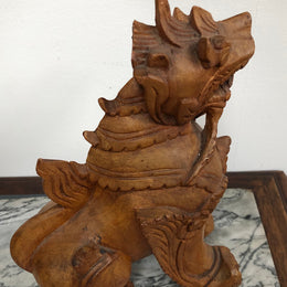 Chinese carved Teak Foo dog with very good detail. In good original condition.