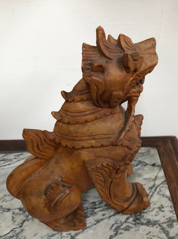 Chinese carved Teak Foo dog with very good detail. In good original condition.