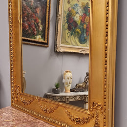 Stunning Vintage French floral gilt framed overmantel mirror. It has been sourced from France and is in good original detailed condition.
