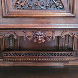 Spectacular French Walnut Renaissance Style buffet with amazing detailed carvings. Plenty of storage space with five cupboards and two large drawers. The three top cupboards open up to two adjustable shelves in each section and the two bottom drawers open up to one large fully adjustable shelve. In good original detailed condition.