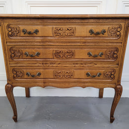 French Oak Louis 15th style nicely carved three drawer wooden top commode. It has been sourced from France and is in good original detailed condition.