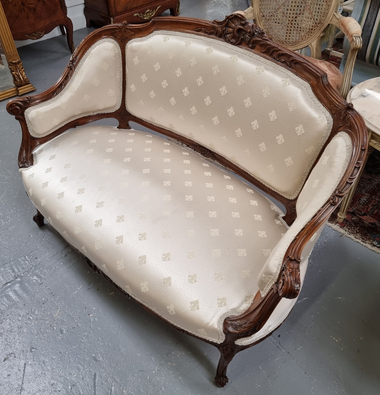 Pretty French Louis XV style small Walnut settee with very good upholstery. Sourced from France and in good original condition, please view photos of the upholstery as it helps form part of the description.