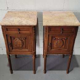Pair of Louis XV French Oak and marble top bedside cabinets. They have beautiful detailed carving and stunning colour marble top. They are in very good original detailed condition.
