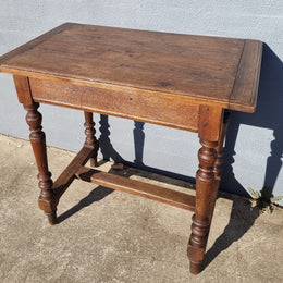 Lovely Oak Tudor style rope edge sideboard with leadlight centre door, three drawers and two solid cupboards. In good original condition.
