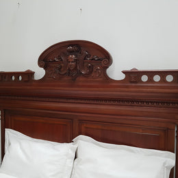 Grand French Henry II style Mahogany queen size bed. Very detailed carvings and comes with custom made bed slats, simply just put your mattress on top. In very good condition.