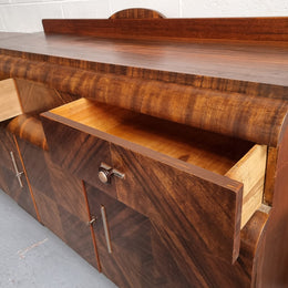 Vintage Walnut Art Deco “Waterfall” sideboard buffet with two drawers and two doors. It is in good original condition and has been sourced locally.