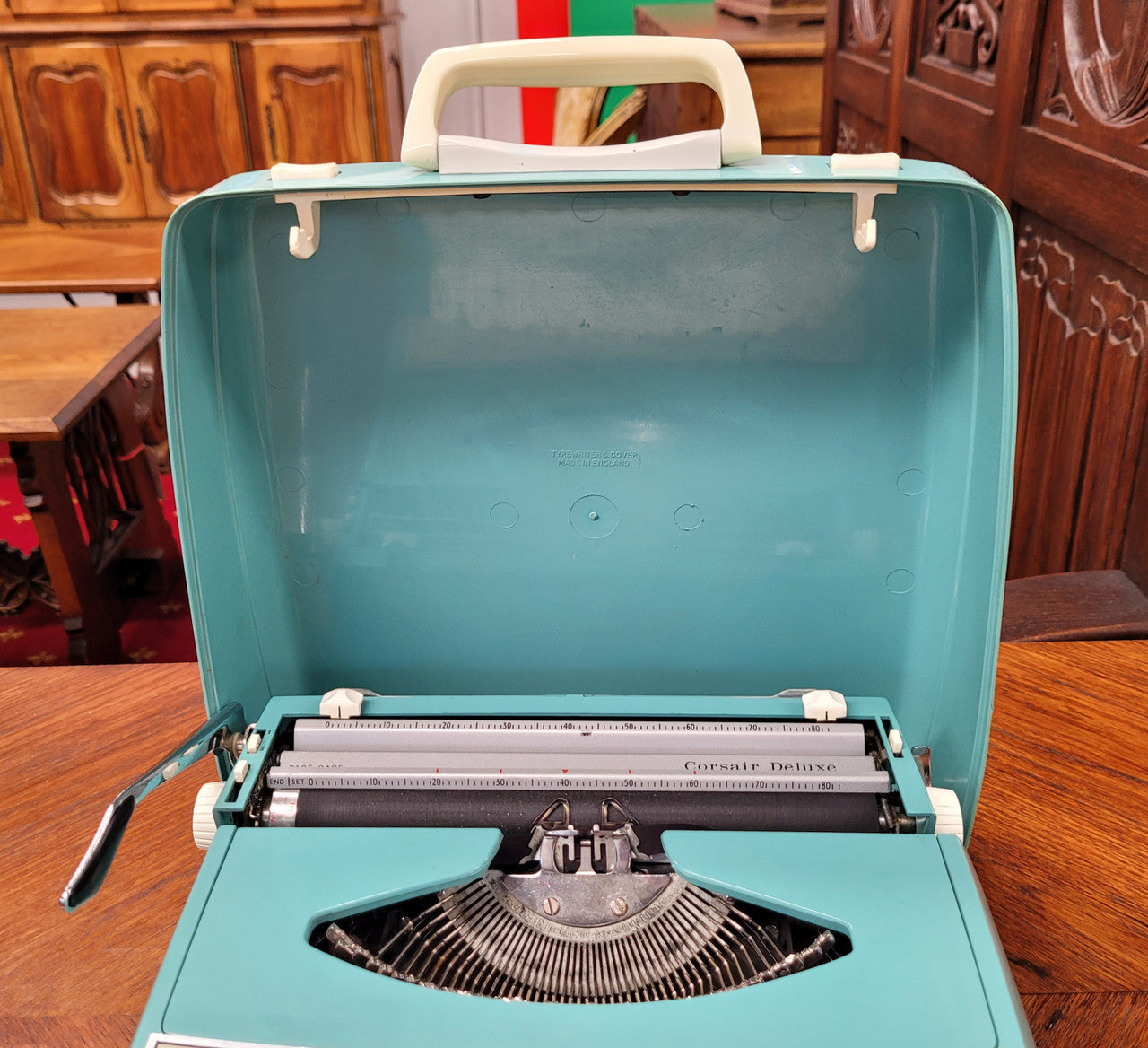 1960's Smith Corona Corsair deluxe portable typewriter. It is in working condition with a used ribbon, and comes with everything pictured. It has been sourced locally.