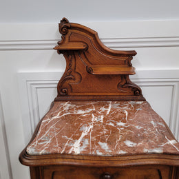 French Louis XV style Walnut single bedside cupboard with inset marble top. It has been sourced from France and is in good original detailed condition.