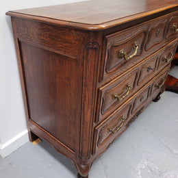 French Provincial Oak three drawer wooden top commode. It has elegant carvings and handles. It has been sourced from France and is in good original detailed condition.