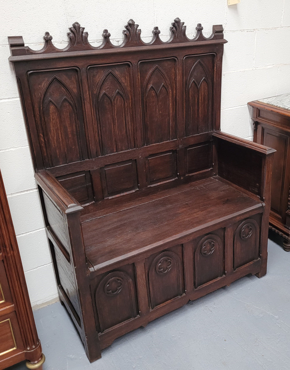 French Oak 19th Century gothic style high backed hall seat. Amazing detailed carving and is good detailed condition.