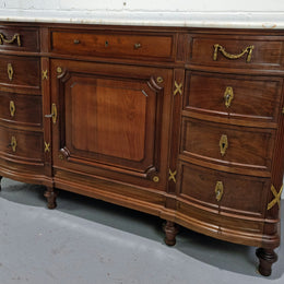 Fabulous French Walnut Louis XVI style cupboard, with a lovely marble top and nine drawers. There is also a cupboard and beautiful ormolu mounts. It is in good original detailed condition.