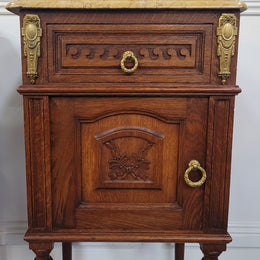 French Oak pair of Louis 16th style marble top bedsides with stunning bronze mounts. They have been sourced from France and are in good original detailed condition.
