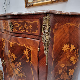 Stunning French Transitional style Mahogany marquetry inlay salon cabinet in the bombe shape. It has one draw, one shelf, marble top & ormolu decoration. Sourced from France and in good original detailed condition.