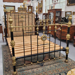 Rare Antique cast iron and brass Victorian queen size bed. Comes with custom made slats.  It has been sourced locally and is in good original condition.
