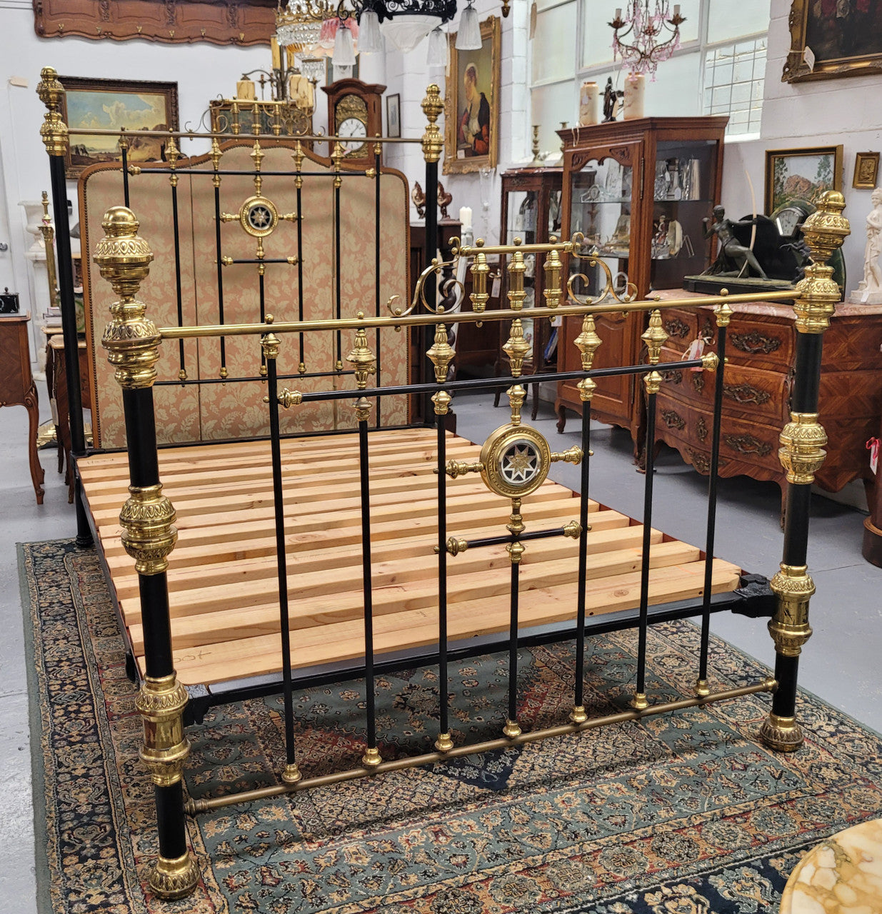 Rare Antique cast iron and brass Victorian queen size bed. Comes with custom made slats.  It has been sourced locally and is in good original condition.