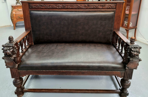 Superbly carved early 19th century newly upholstered French Oak hall seat of grand proportions and lovely details in good condition.