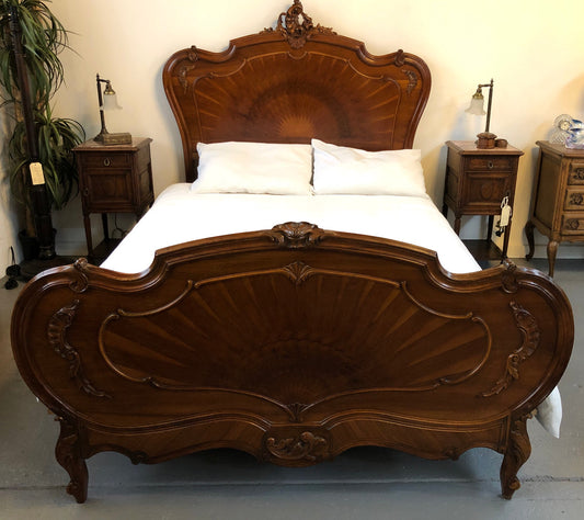 French queen size Walnut beautifully carved bed with inlay depicting the Sun . It has comes with steel rails and custom made slats all you need to do is put your mattress straight on top. In very good original detailed condition.