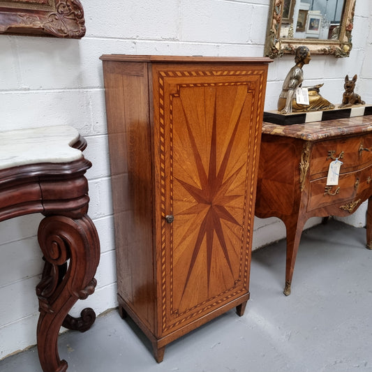 French Art Deco inlaid Oak curio/side cabinet with a lift up top and glass underneath. There are two fixed shelves, two adjustable shelves and one hidden drawer. Sourced from France and in good original condition.