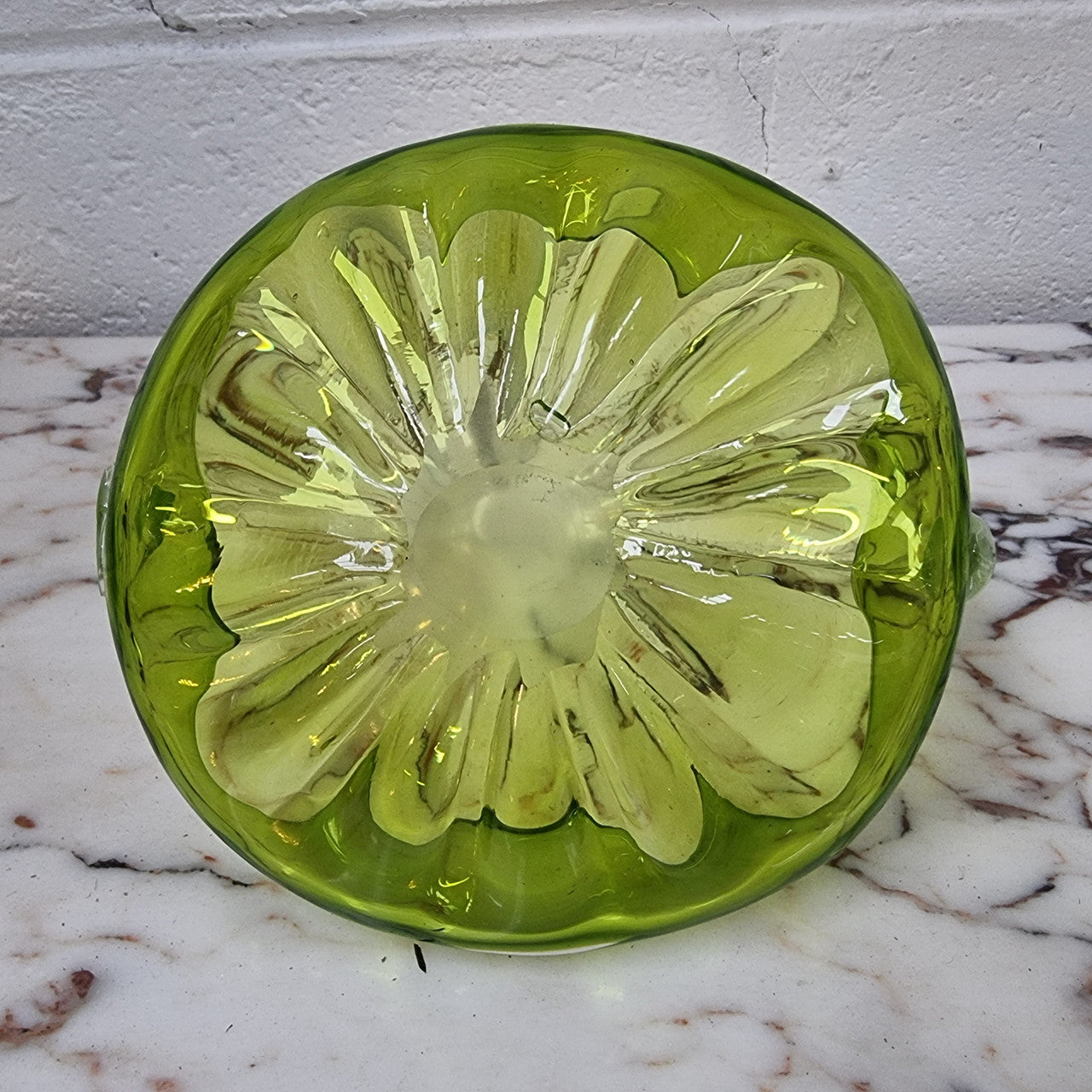 Delightful art glass vintage basket. Green glass bowl and clear handle.