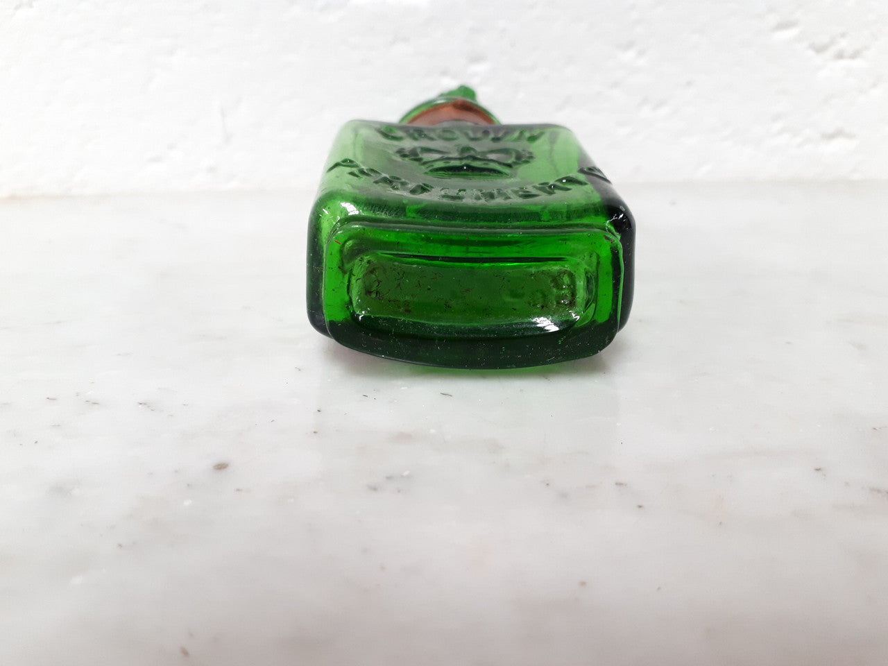 Victorian green glass Crown perfume bottle. In good original condition.