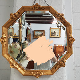 A beautiful Vintage octagon shape ornate gilt mirror, with bevelled glass and in good original condition.