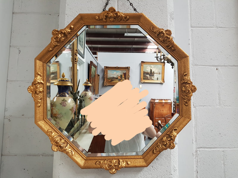 A beautiful Vintage octagon shape ornate gilt mirror, with bevelled glass and in good original condition.