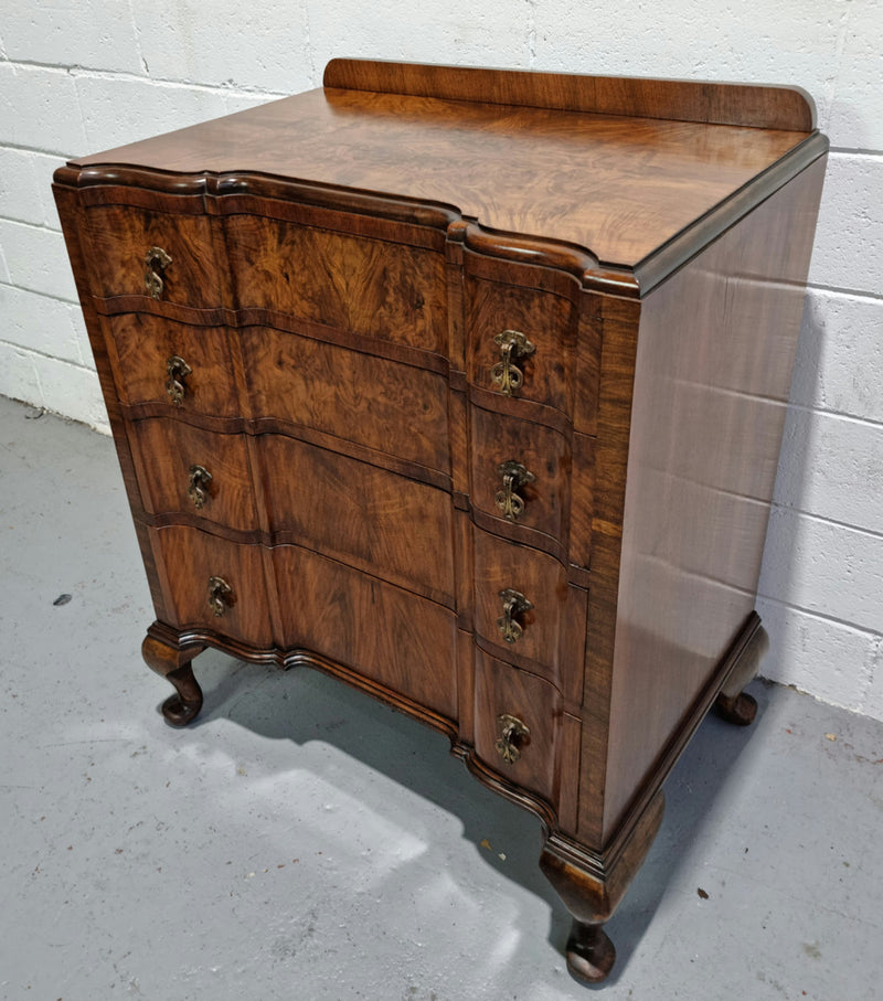 Antique English Figured Walnut inverted serpentine fronted chest of drawers. It is a great quality piece and is in good restored condition.