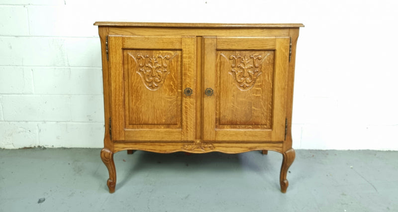 Vintage French Oak two door cabinet which would make an ideal TV cabinet or storage unit. In good original detailed condition.