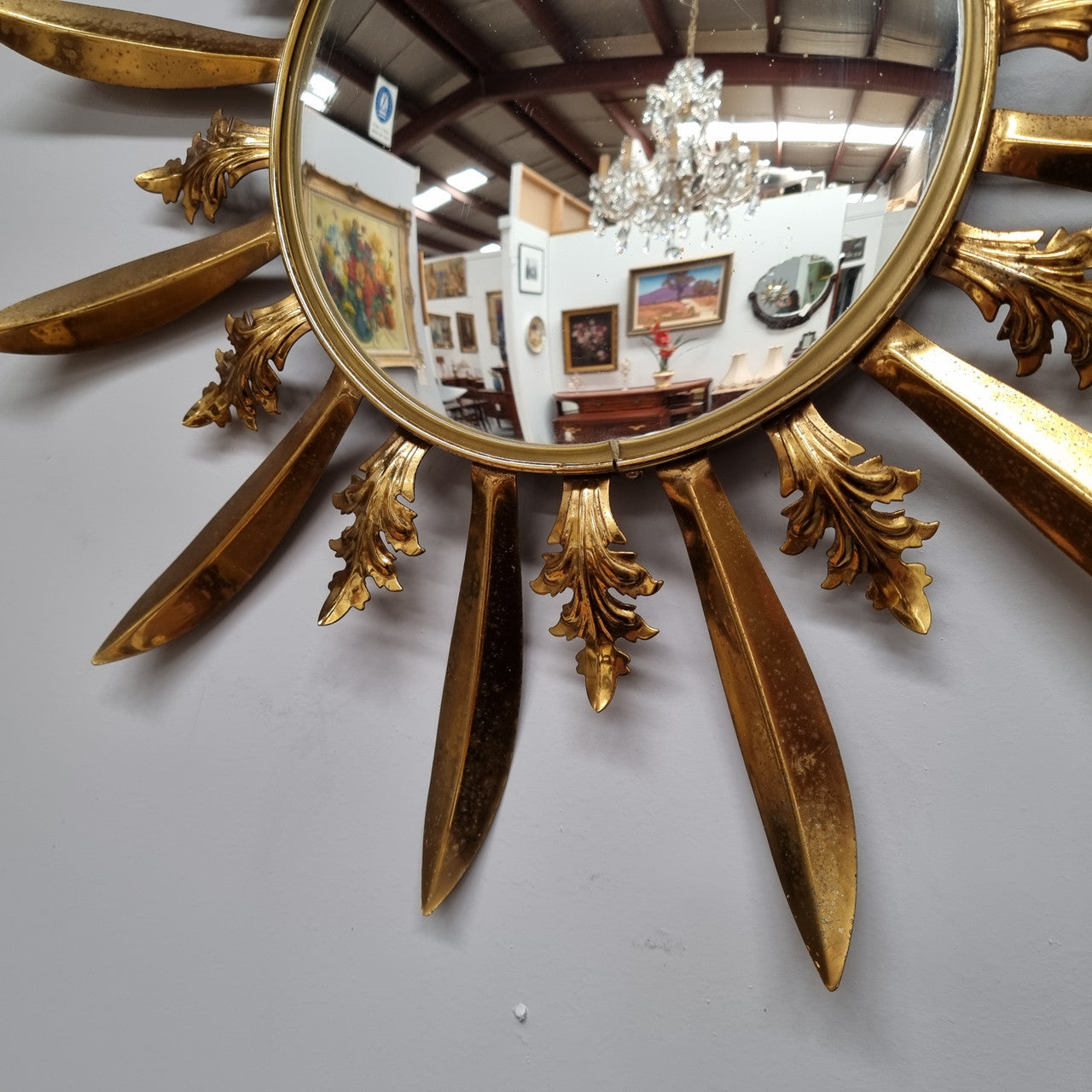 Stunning French Vintage gilt metal starburst convex mirror. It has been sourced from France and in good original detailed condition. Please note mirror does have some spotting due to age but only adds to its character.