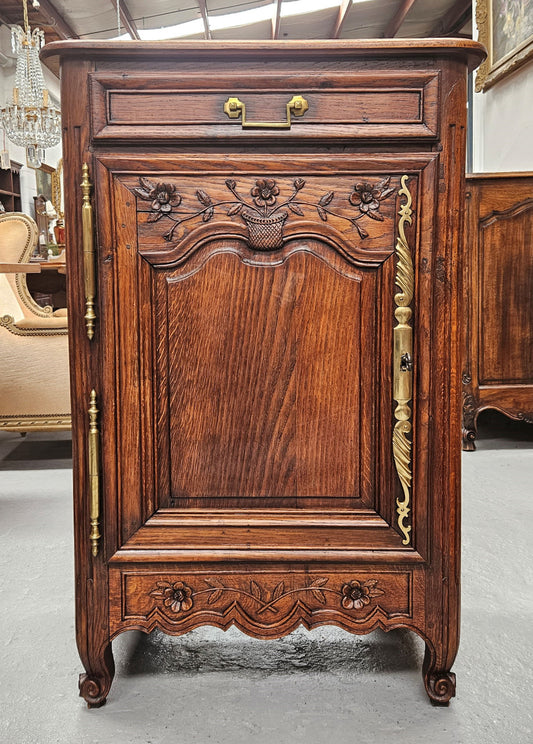 Louis 15th style oak 19th century cabinet with lovely brass hinges, handles & charming carving.  Circ: 1860's. In good original condition.