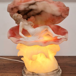 A superb original hand carved Art Deco lamp. Alabaster and marble sculpture of a nude woman inside a clam shell. Italian, inscription to base. Circa 1920's. Subtle colouring to clam shell for a sunset effect. This is a world class example of a true Art Deco sculpture lamp. It is in good original detailed condition, please view photos as they help form part of the description.