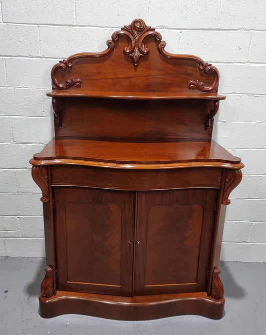 Beautiful Antique Victorian Mahogany two door Chiffonier. Plenty of storage space with one drawer and the two doors open up to a shelved area. It is in good restored condition.