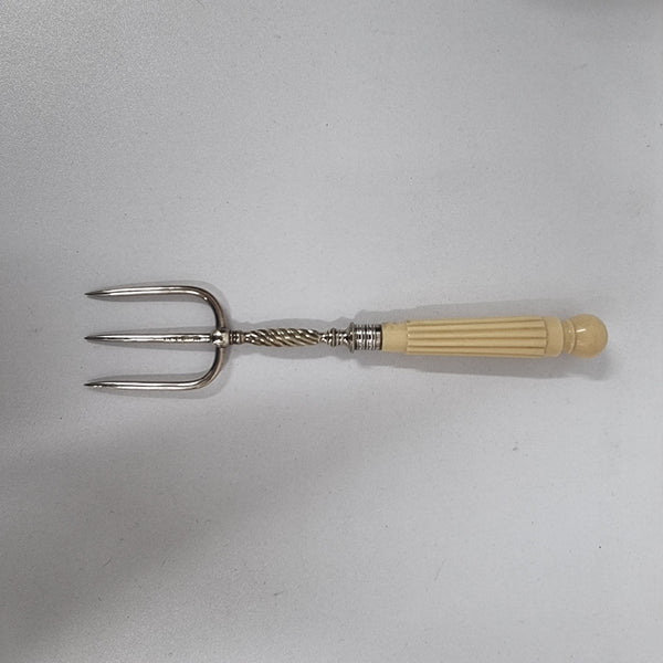 Elegant Antique pickle fork with a ivory handle. It is in good original condition, please view photos as they help form part of the description.