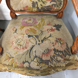 Pair of French Walnut Tapestry covered armchairs. They are in good original detailed condition. Slight wear and tear to fabric but still in good condition please view photos.