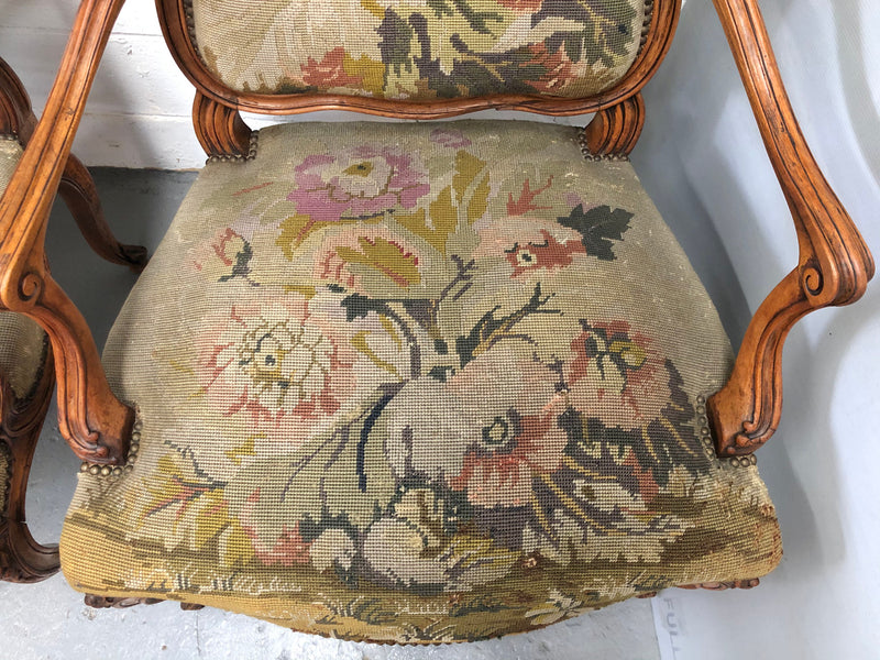 Pair of French Walnut Tapestry covered armchairs. They are in good original detailed condition. Slight wear and tear to fabric but still in good condition please view photos.