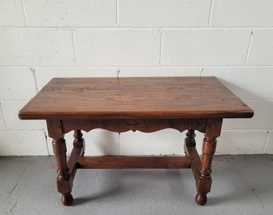 Small French Oak rustic coffee table. Perfect size for a small area and it is in good original detailed condition.