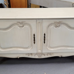 Louis XV style chalk painted two door cabinet which would also make an ideal TV cabinet. It has been sourced from France and in good original detailed condition.