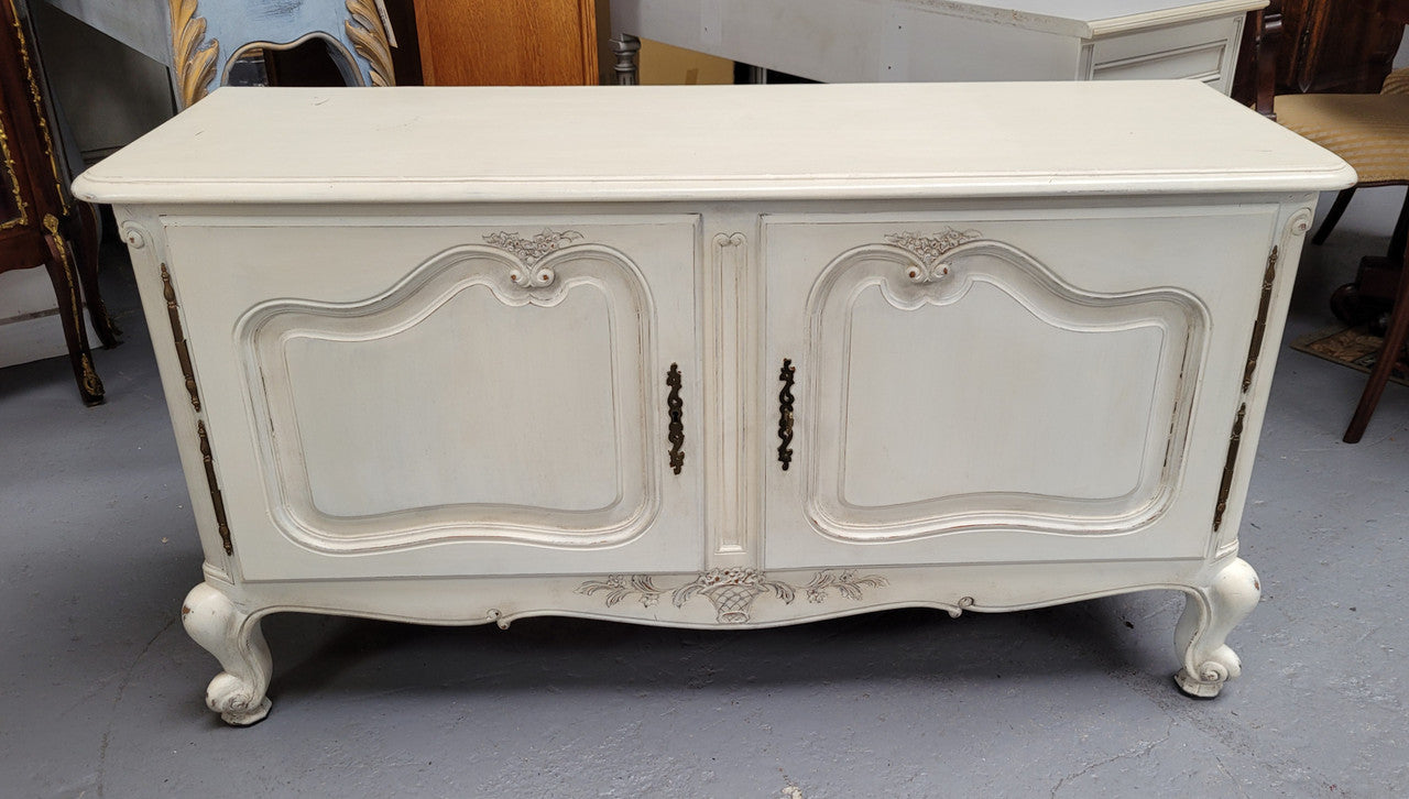 Louis XV style chalk painted two door cabinet which would also make an ideal TV cabinet. It has been sourced from France and in good original detailed condition.