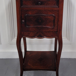 French Rosewood inset marble top single bedside cabinet with one drawer and one cupboard on elegant legs. Would also make a practical and stunning table lamp. It is in good original detailed condition.