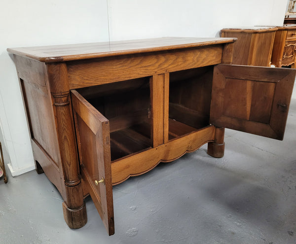French 19th Century Oak dough bin buffet. The heavy solid top lifts upto reveal a half barrel compartment where traditionally flour and yeast were poured, mixed and proofed to grow into a nice dough. 

Although originally intended for dough this would make an ideally TV cabinet with the two doors opening with plenty of storage.
