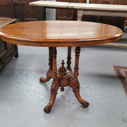 Victorian Walnut oval beautifully inlaid occasional table with bird cage undercarriage. It is in good original detailed condition and it has been sourced locally.