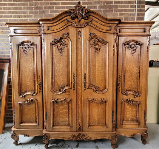 Amazing French Oak Louis XV style four door armoire. Plenty of storage space and beautifully carved throughout. In good original detailed condition and sourced from France. Please contact us for further photos.