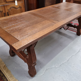 Purchased from France we have this amazing French Oak Spanish style farmhouse table featuring striking iron work underneath. It has been finished with an oil & wax finish making it more water resistant, stain resistant and durable then a natural wax finish. It can sit 6-8 people comfortable and is good restored condition.