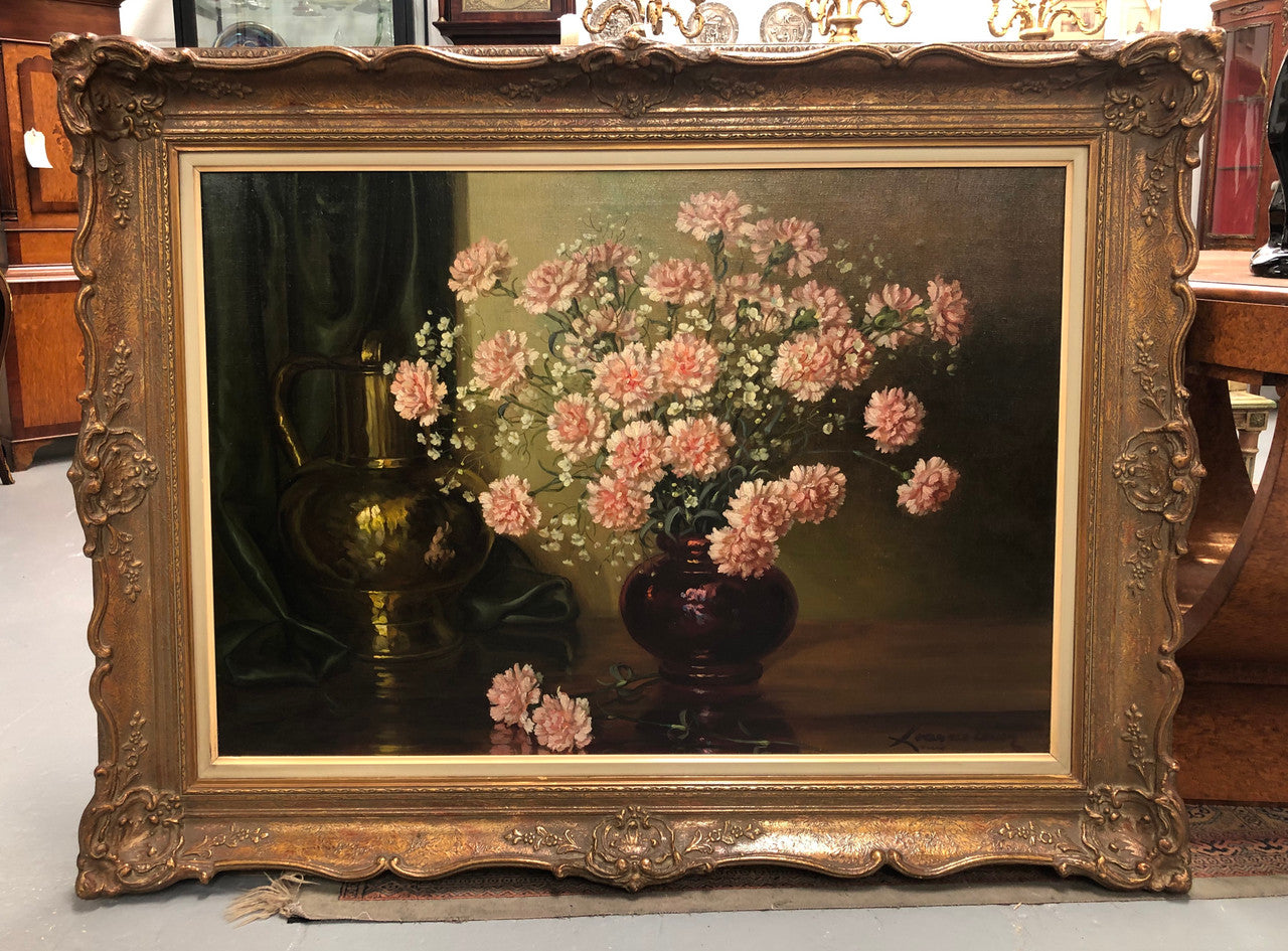 A signed oil on canvas painting of Carnations flowers in an ornate gilt original frame. Circa 1900's in good original condition.