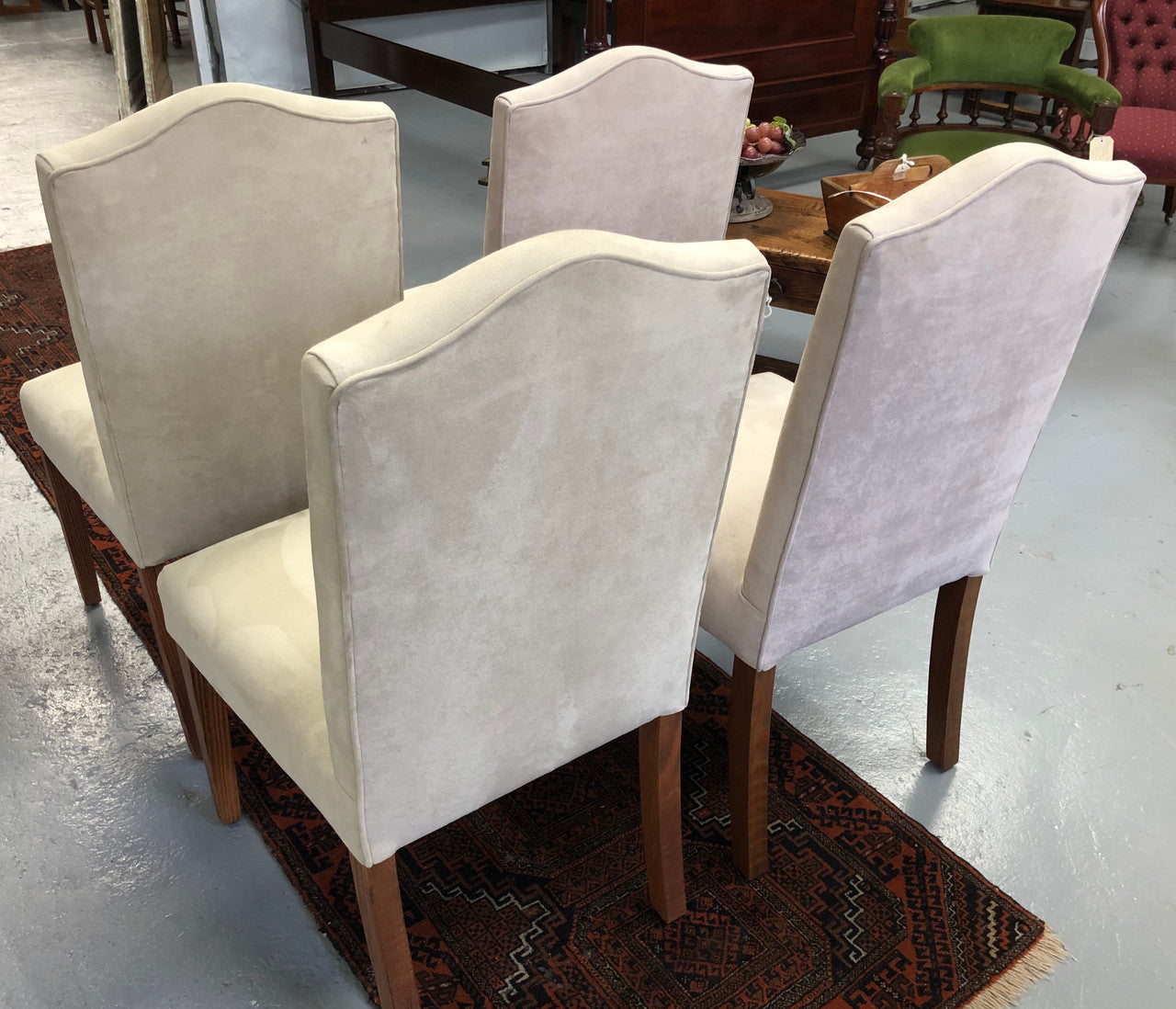 Beautiful set of four upholstered taupe/ light fawn dining chairs which are very comfortable to sit in. They are in good original condition.