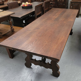 Spanish style French Oak farmhouse table with ironwork underneath. It is in good original detailed condition and has been sourced from France.